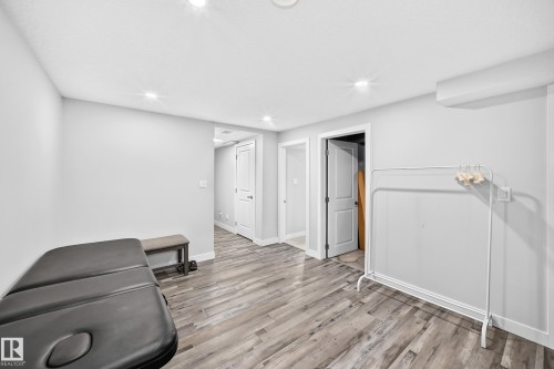 Wood-finish flooring, white walls, recessed ceiling lighting, and white interior doors - 4216 47 Street Nw, Edmonton, AB 