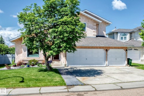 Stucco exterior with a two-car garage and concrete driveway - 4216 47 Street Nw, Edmonton, AB 