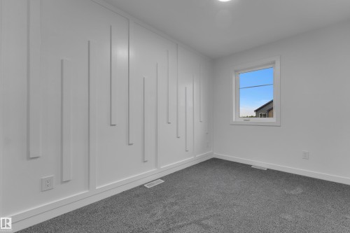 Accent wall featuring vertical paneling - 265 Falcon Crescent, Leduc, AB 