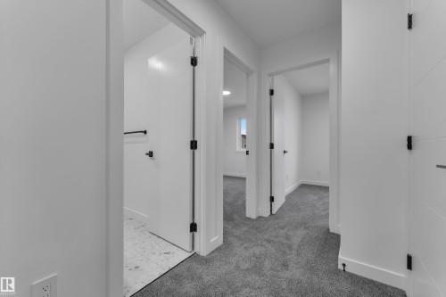 Modern interior doors with matte black hardware - 265 Falcon Crescent, Leduc, AB 