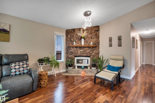 3 Flint Crescent, St. Albert, AB - Indoor Photo Showing Living Room With Fireplace