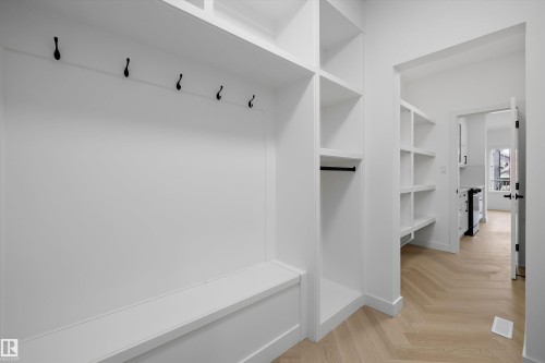 Built-in entryway bench with integrated storage and coat hooks - Edmonton, AB 