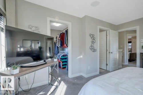 Looking towards large WIC (with window) and 4-pc ensuite - 160 Desrochers Gate Sw, Edmonton, AB 