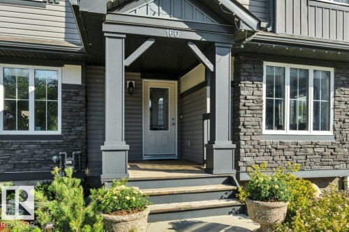 Covered front veranda - 160 Desrochers Gate Sw, Edmonton, AB 