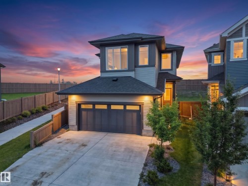 Modern two-story residence featuring light siding and dark trim - 22650 99A Avenue Nw, Edmonton, AB - Outdoor