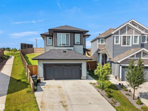 Modern two-story residence featuring light gray siding and a dark gray roof - 22650 99A Avenue Nw, Edmonton, AB - Outdoor