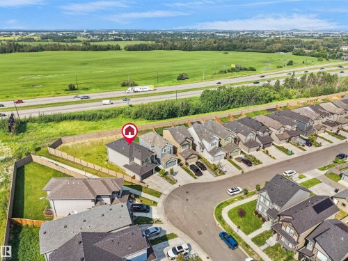 Aerial perspective highlighting a residential property with a multi-level structure and attached garage - 22650 99A Avenue Nw, Edmonton, AB - Outdoor With View