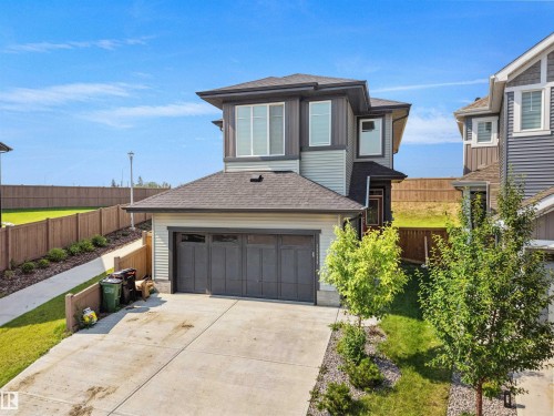 Contemporary two-story exterior featuring multi-toned siding, an attached garage, and a concrete driveway - 22650 99A Avenue Nw, Edmonton, AB - Outdoor