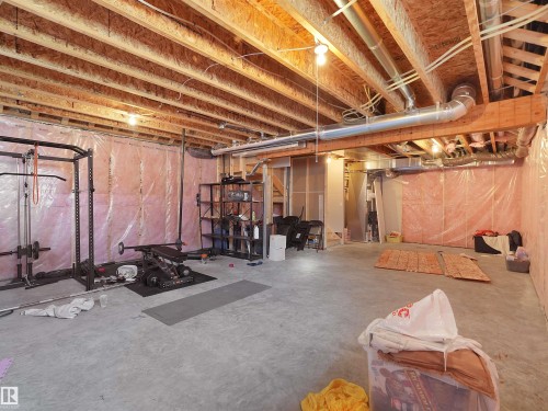 Expansive unfinished basement featuring exposed wood joists and concrete flooring - 22650 99A Avenue Nw, Edmonton, AB - Indoor Photo Showing Basement