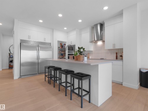 Modern kitchen featuring light wood-finish flooring and recessed lighting - 22650 99A Avenue Nw, Edmonton, AB - Indoor Photo Showing Kitchen With Upgraded Kitchen