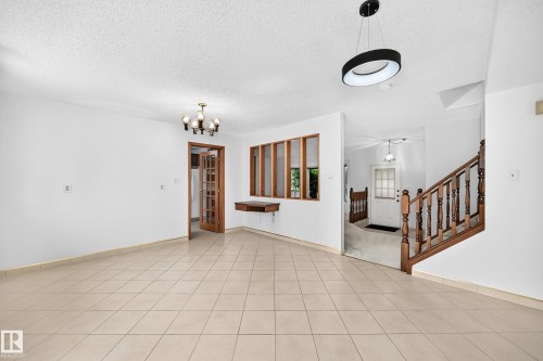 Tile flooring throughout, wood-finish staircase - 17915 99A Avenue Nw, Edmonton, AB 