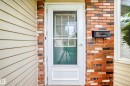 Red brick exterior with light-toned siding - 17915 99A Avenue Nw, Edmonton, AB 