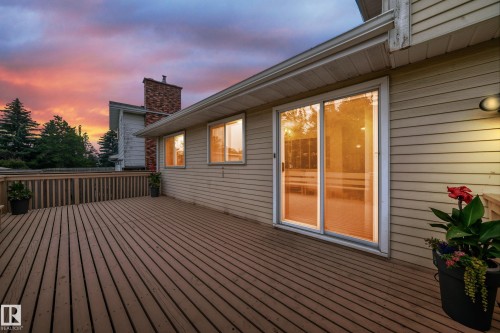 Spacious wood-finish deck with a wood railing - 17915 99A Avenue Nw, Edmonton, AB 