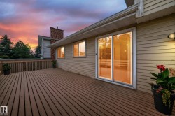 Spacious wood-finish deck with a wood railing - 