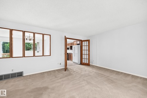Neutral tone carpeting and French doors - 17915 99A Avenue Nw, Edmonton, AB 
