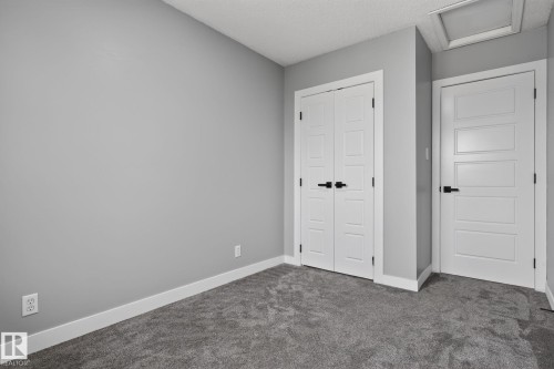 Room featuring light gray walls, gray carpet, white baseboards, and white trim - 9530 174 Avenue Nw, Edmonton, AB - Indoor Photo Showing Other Room