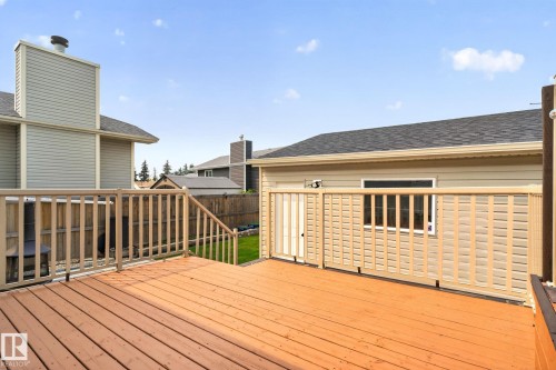 Expansive wood deck with a full railing system - 9530 174 Avenue Nw, Edmonton, AB - Outdoor With Exterior