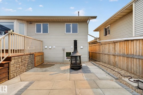 Backyard patio featuring a dark metal chiminea - 9530 174 Avenue Nw, Edmonton, AB - Outdoor With Exterior