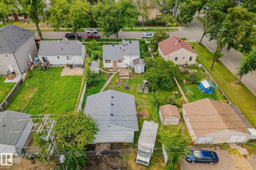 Residential property with a spacious backyard, detached garage, and a secondary shed structure - 11935 125 Street Nw, Edmonton, AB 