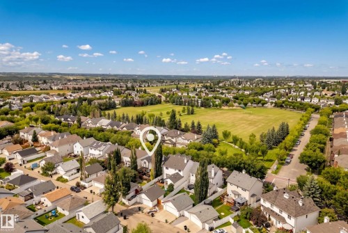 Expansive neighborhood featuring residential properties, mature trees, and open green spaces - 1660 Tomlinson Common Nw, Edmonton, AB 