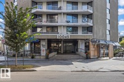 Multi-story building with a concrete facade and multiple balconies - 