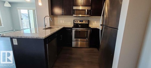 #302 3670 139 Av Nw, Edmonton, AB - Indoor Photo Showing Kitchen With Upgraded Kitchen