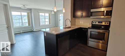 #302 3670 139 Av Nw, Edmonton, AB - Indoor Photo Showing Kitchen With Double Sink