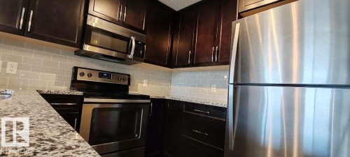 #302 3670 139 Av Nw, Edmonton, AB - Indoor Photo Showing Kitchen With Upgraded Kitchen