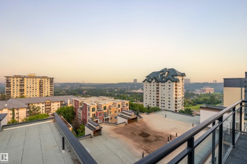 Balcony with glass railing overlooking urban and natural landscapes - #713 10503 98 Av Nw, Edmonton, AB - Outdoor With Balcony With View