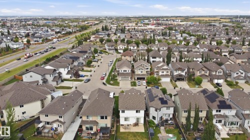 Residential development featuring multiple properties with shingled roofs - 1564 36 Avenue Nw, Edmonton, AB 