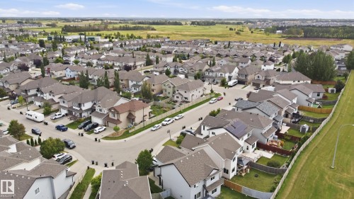 Residential neighborhood featuring detached homes with varied architectural styles and gray shingle roofs - 1564 36 Avenue Nw, Edmonton, AB 