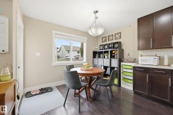 Dark wood-finish flooring with light wall tones and white trim - 