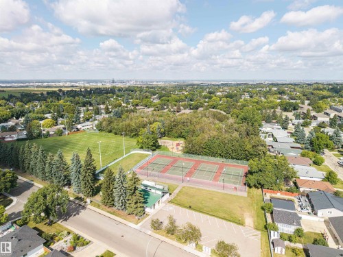 Expansive green space featuring a large sports field, multiple tennis courts, and mature trees - 9 Hawkins Crescent, Sherwood Park, AB 