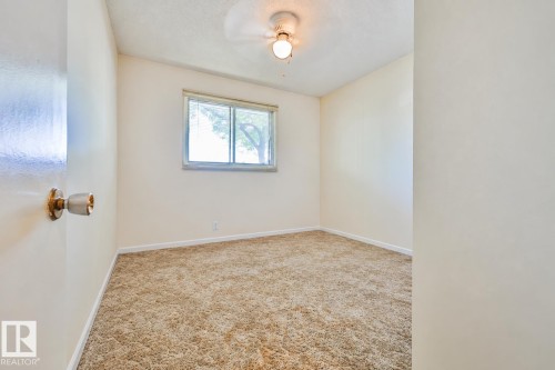 Carpeted flooring, single window, and a ceiling-mounted light fixture - 9 Hawkins Crescent, Sherwood Park, AB 