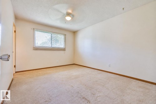 Carpeted flooring, neutral wall tones, and a ceiling-mounted light fixture - 9 Hawkins Crescent, Sherwood Park, AB 