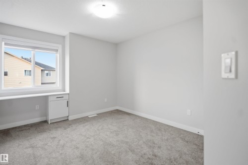 #46 1703 16 Av Nw, Edmonton, AB - Indoor Photo Showing Other Room