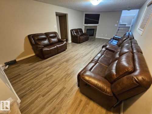 Basement family room w/ gas fireplace - 4315 151 Avenue Nw, Edmonton, AB 