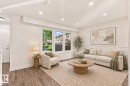 Recessed ceiling lighting, wood-finish flooring, large multi-pane window, decorative wall molding, and white interior doors - 17325 85 Avenue Nw, Edmonton, AB 