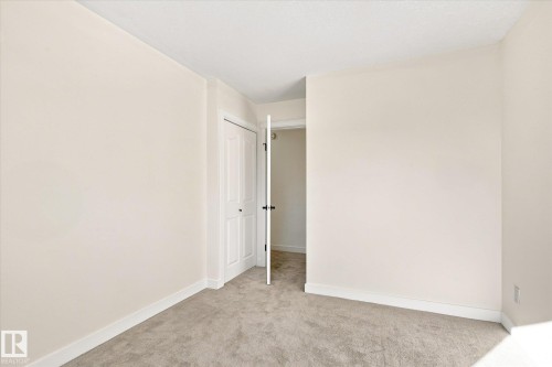 Neutral-toned walls and carpeted flooring - 17325 85 Avenue Nw, Edmonton, AB 