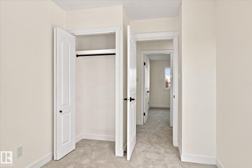 Plush carpeting, interior paneled doors, and contemporary black hardware - 17325 85 Avenue Nw, Edmonton, AB 
