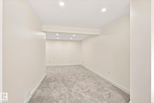 Recessed lighting, light gray carpeting, and neutral wall paint - 17325 85 Avenue Nw, Edmonton, AB 