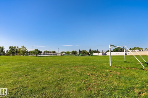 Expansive green space featuring a soccer goal and distant structures - 17325 85 Avenue Nw, Edmonton, AB 