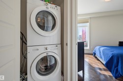 White stackable front-loading washer and dryer units - 