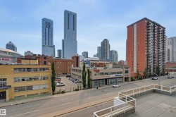 Urban skyline featuring multiple high-rise buildings and surrounding commercial structures - 