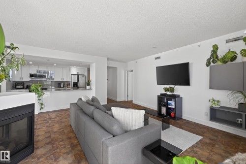 #701 10028 119 St Nw, Edmonton, AB - Indoor Photo Showing Living Room With Fireplace