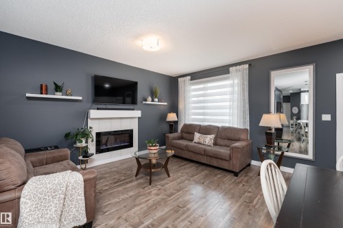 6 Hickory Road, Fort Saskatchewan, AB - Indoor Photo Showing Living Room With Fireplace