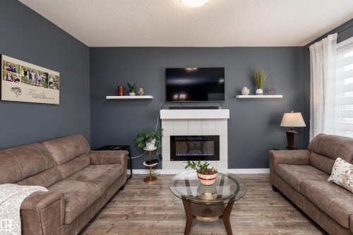 6 Hickory Road, Fort Saskatchewan, AB - Indoor Photo Showing Living Room With Fireplace