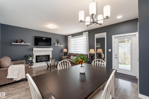 6 Hickory Road, Fort Saskatchewan, AB - Indoor Photo Showing Dining Room With Fireplace