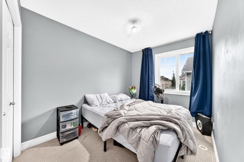 Recessed window, textured carpeting, neutral wall color, and white trim - #146 655 Tamarack Rd Nw, Edmonton, AB 