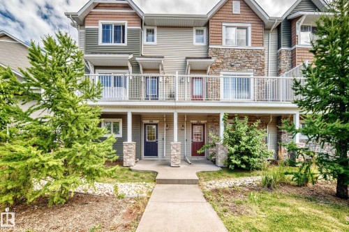 Multi-level exterior with stone accents and horizontal siding - #146 655 Tamarack Rd Nw, Edmonton, AB 